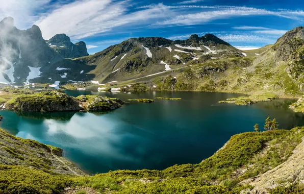 The sky, grass, the sun, clouds, mountains, fog, lake, stones