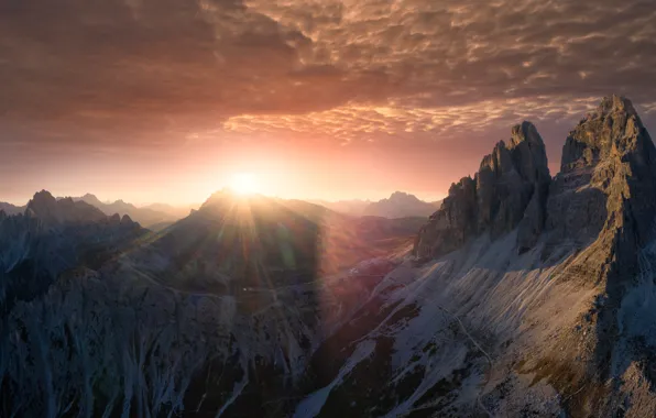Picture the sky, the sun, clouds, rays, mountains, rocks, dawn, tops