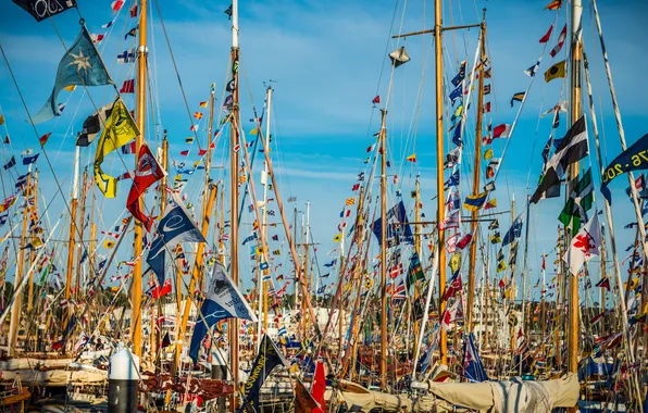 The sky, yachts, boats, mast, flags, harbour