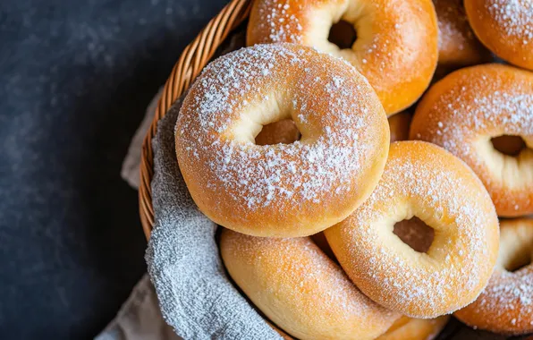 Towel, bagels, donuts, basket, cakes, bagels, powdered sugar, buns