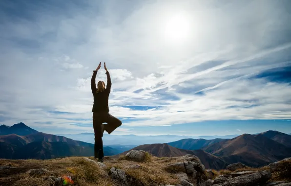 Picture girl, the sun, mountains, yoga
