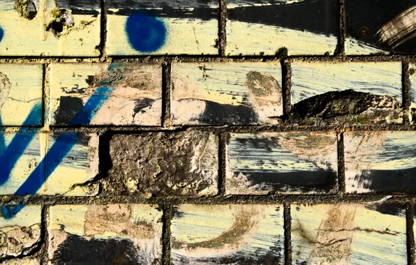 Picture dirt, bricks, spray paint, different colors, wwall