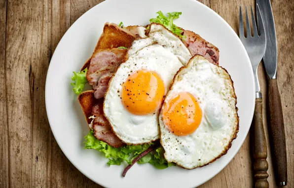 Leaves, eggs, plate, bread, knife, plug, bacon, salad