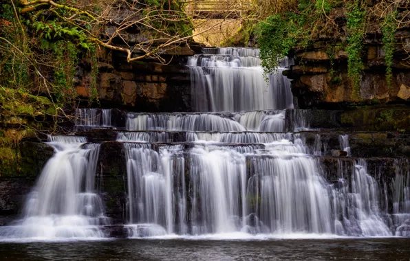 Picture the dark background, rocks, waterfall, stream, cascade