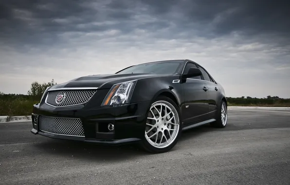Picture the sky, asphalt, clouds, clouds, black, Cadillac, CTS, black