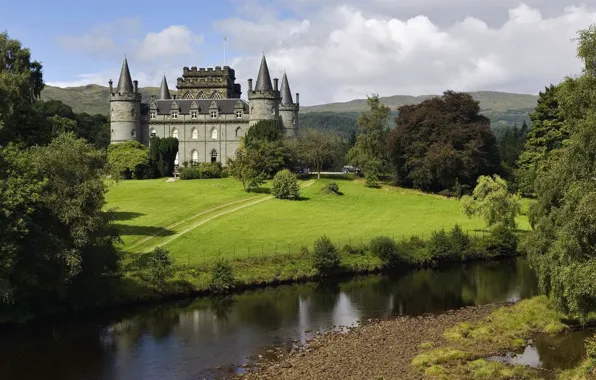 The sky, trees, river, castle, tower