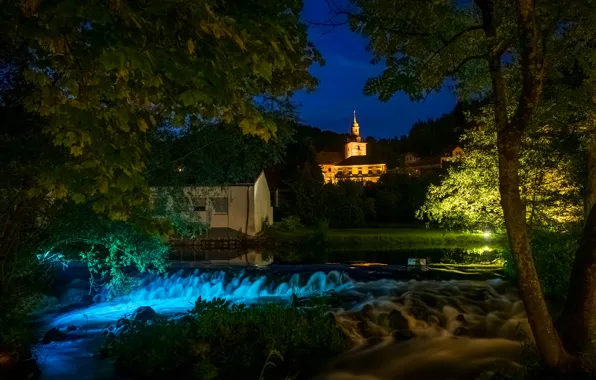 Picture the sky, trees, night, branches, lights, river, foliage, waterfall