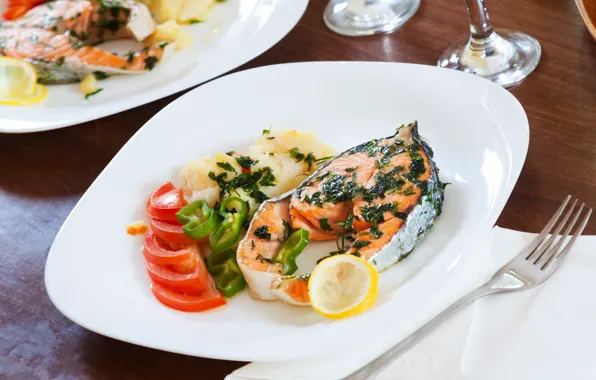 Greens, lemon, plate, pepper, sauce, tomatoes, salmon, steak