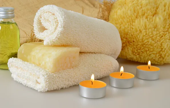 Towel, candles, soap, washcloth, shower gel, aromatic oil