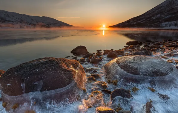 Picture the sky, the sun, sunset, stones, pond