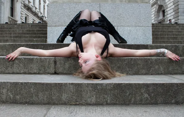 Girl lying on the stairs