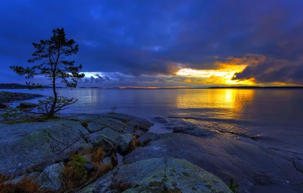 The sky, water, clouds, trees, sunset, stones