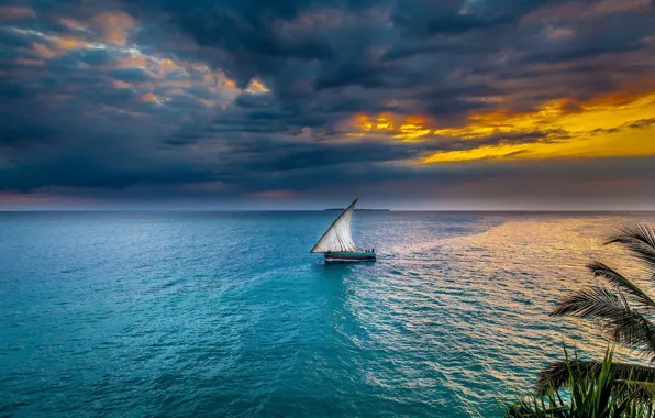 Sea, sunset, sailboat