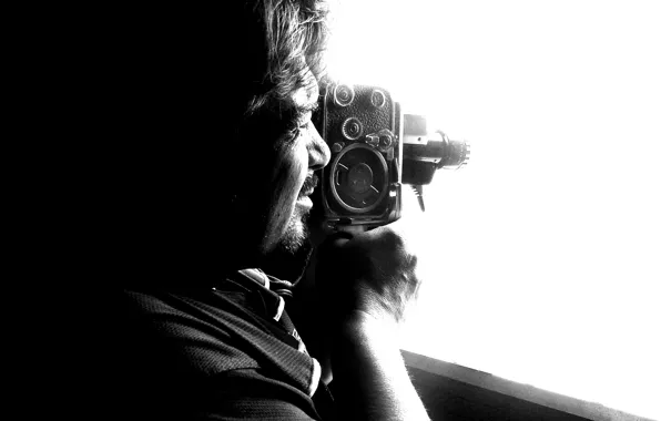 Picture camera, man, filmmaker, white and black