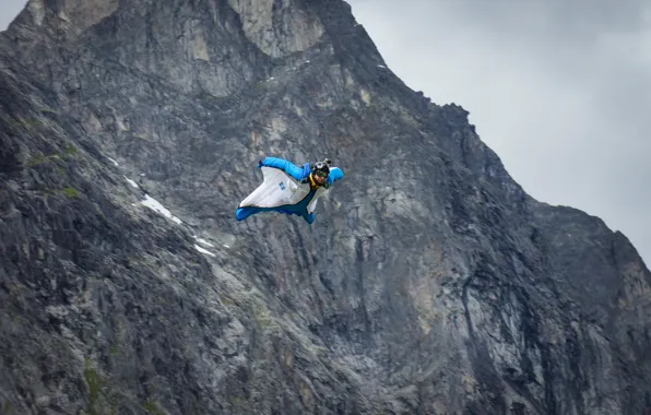 Flight, mountains, rocks, camera, parachute, container, helmet, pilot