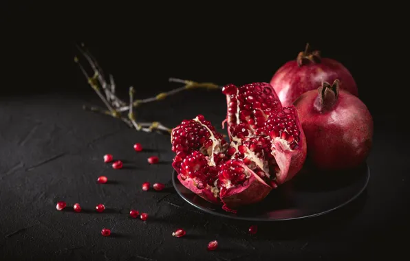 Branches, the dark background, table, plate, fruit, grenades, pomegranate grains