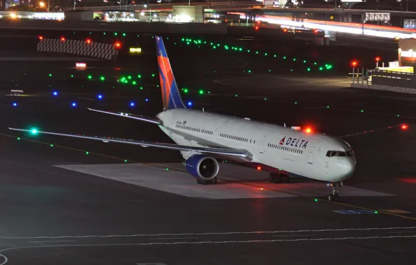 Night, the airfield, a passenger plane