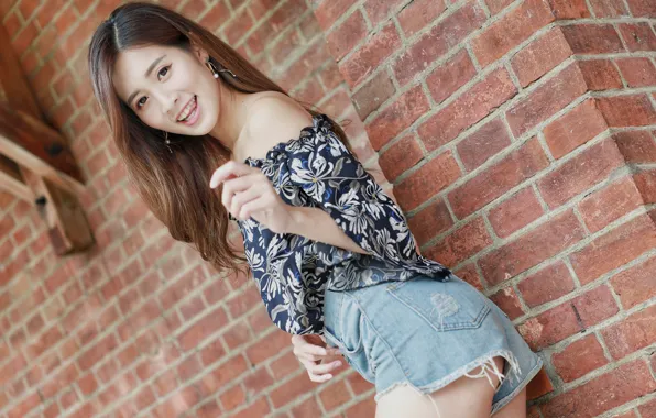 Picture girl, wall, shorts, asian, smiling, posing, brick, young woman