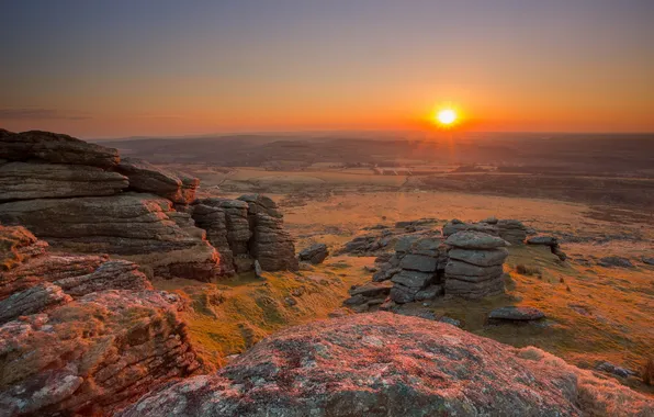 Field, sunset, stones