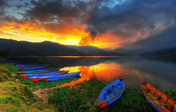 Picture the sky, grass, clouds, trees, sunset, mountains, lake, boats