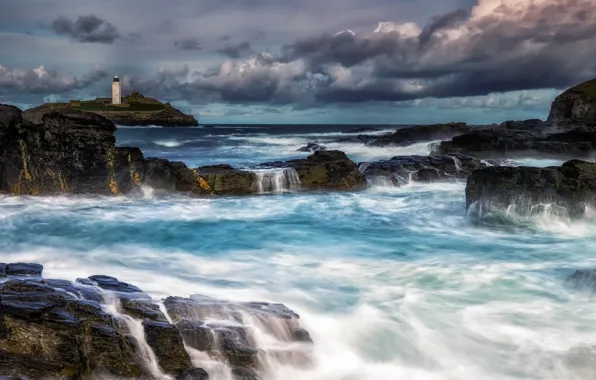 Sea, shore, lighthouse