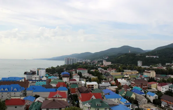 Sea, mountains, the roofs of the houses