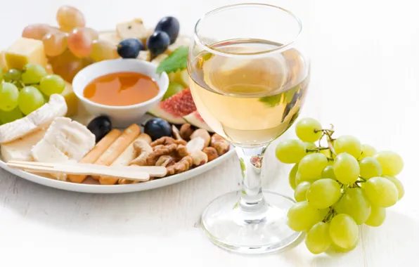 Wine, glass, cheese, honey, grapes, nuts, figs
