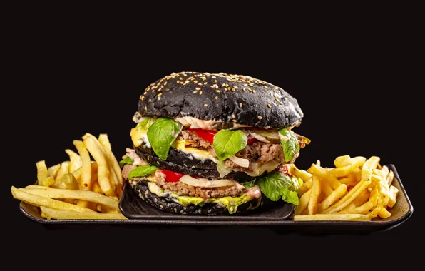 Picture hamburger, the dark background, French fries