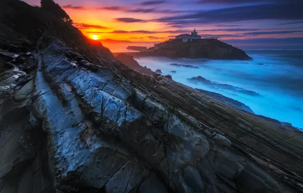 Sea, the sun, clouds, sunset, blue, rocks, shore, lighthouse