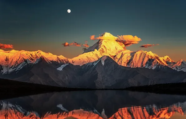 Picture the sky, clouds, snow, sunset, mountains, lake, reflection, rocks