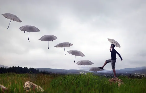 Picture stage, umbrellas, guy