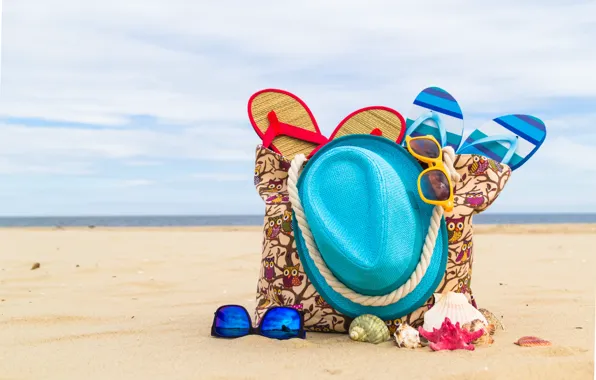 Picture sand, sea, shore, hat, glasses, bag