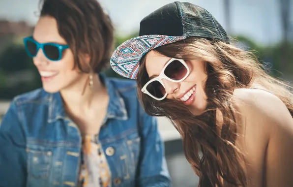 Girls, laughter, glasses, cap