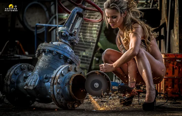 Woman, chains, working, sparks, grinder, wrench Sluice