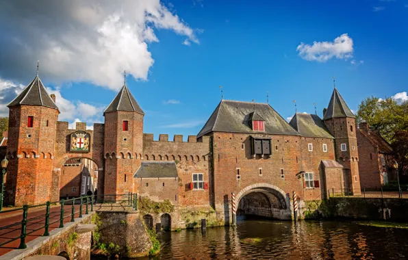 The sky, the sun, clouds, river, castle, wall, channel, tower