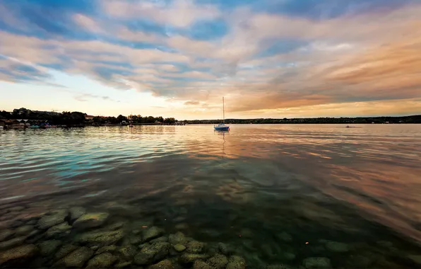 Picture the sky, water, shore, yacht