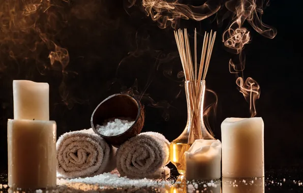 Light, the dark background, smoke, towel, sticks, candles, bowl, placer