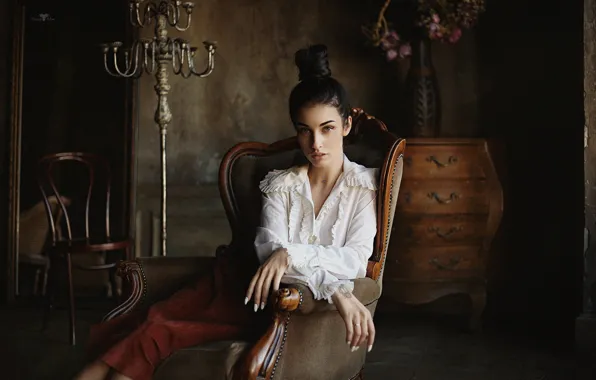 Look, pose, style, chair, hands, blouse, hairstyle, chandelier