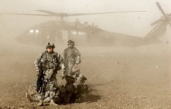Dust, helicopter, soldiers