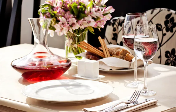Water, flowers, table, wine, food, glasses, bread, plates