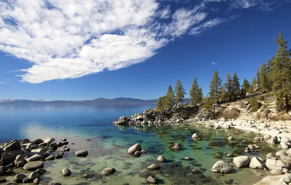 The sky, clouds, trees, stones, lake Tahoe