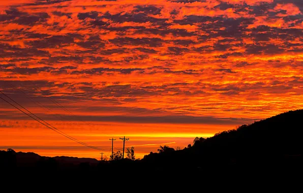 The sky, clouds, sunset, nature, posts, wire, glow
