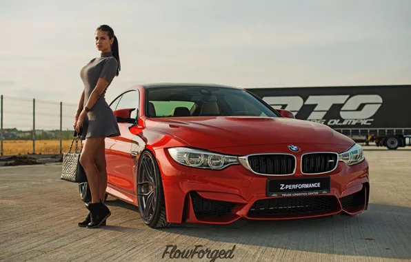 Look, girl, BMW, beautiful girl, is above the machine, red car