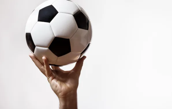 Picture football, the ball, hand, white background