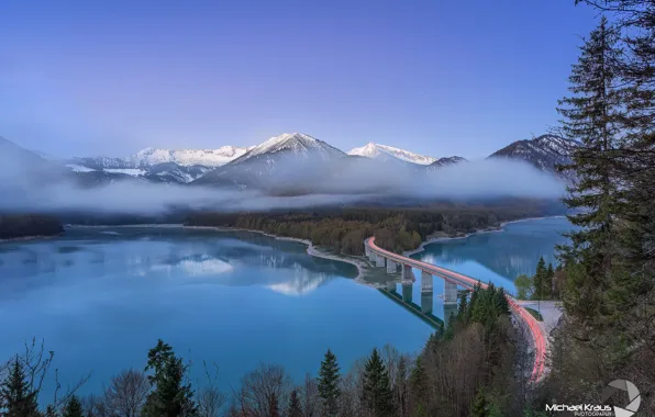 Picture forest, mountains, bridge, lights, fog, lake, excerpt