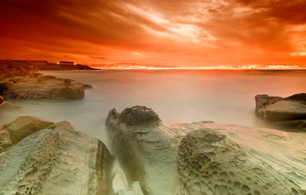 The sky, stones, shore, orange