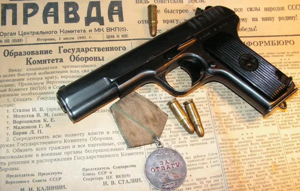 Gun, medal, newspaper, cartridges