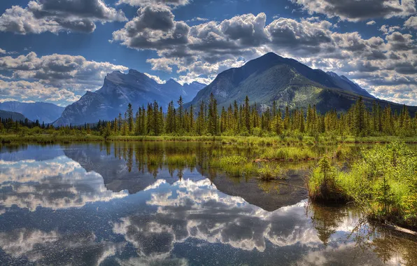The sky, clouds, trees, mountains, lake, reflection
