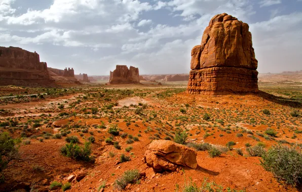 The sky, clouds, mountains, stones, rocks, the bushes