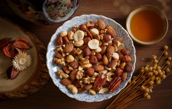 Tea, nuts, almonds, hazelnuts, the dried flowers, pecan, cashews